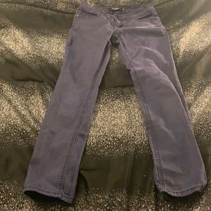 Blue and black colored jeans